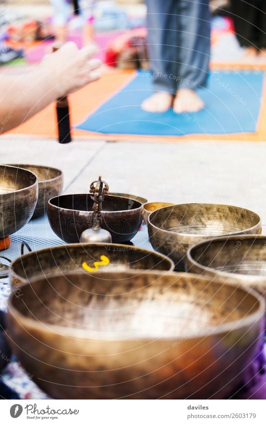 Hand playing yoga bowls outdoors. Bowl Lifestyle Medical treatment Alternative medicine Wellness Relaxation Meditation Spa Leisure and hobbies Music Yoga Metal