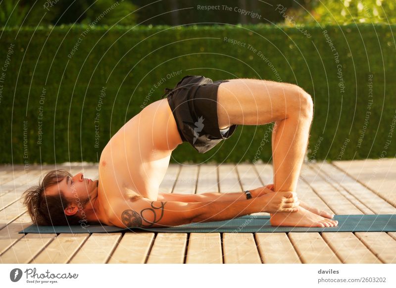 Man doing yoga outdoors. Lifestyle Wellness Harmonious Relaxation Calm Leisure and hobbies Freedom Summer Sports Fitness Sports Training Yoga Human being