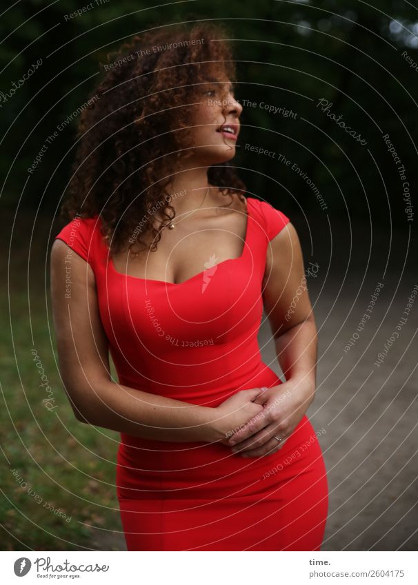 Woman in red dress Feminine Adults 1 Human being Park Meadow Forest Dress Hair and hairstyles Brunette Long-haired Curl Observe To hold on Looking Stand Elegant