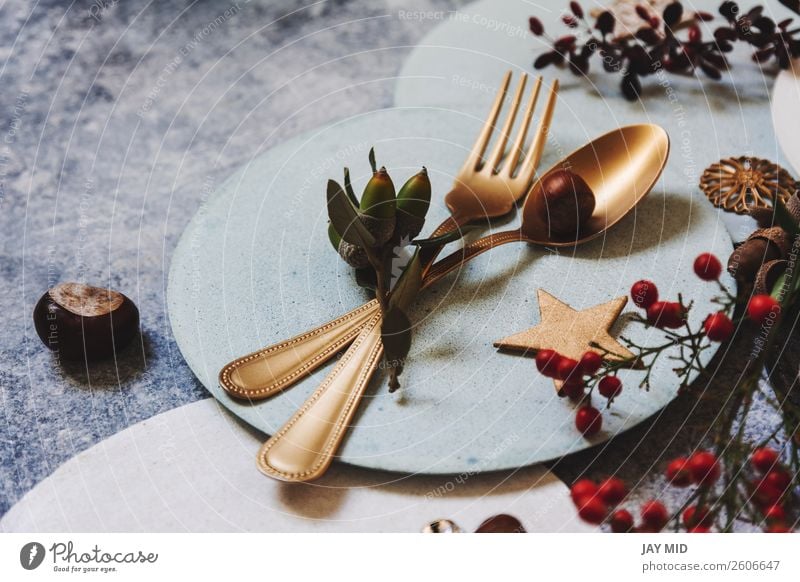 christmas table setting, golden cutlery and nandinas Dinner Plate Fork Spoon Winter Decoration Table Restaurant Feasts & Celebrations Thanksgiving