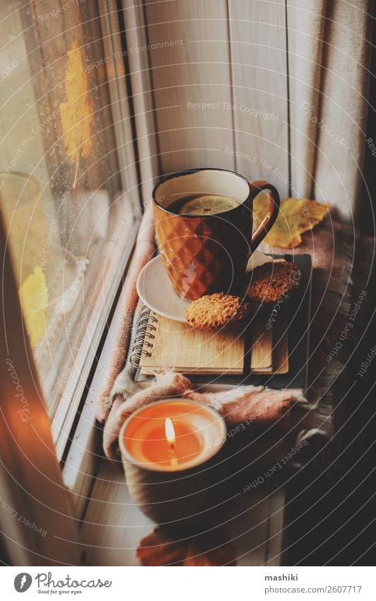 cozy autumn morning at home. Hot tea and candle Breakfast Coffee Tea Lifestyle Relaxation Reading Book Autumn Winter Weather Rain Safety (feeling of)