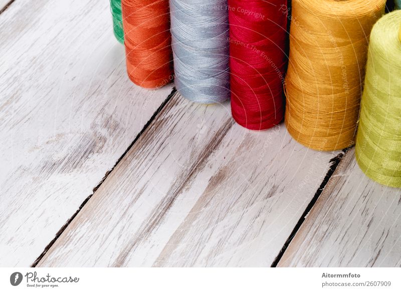 Close-up on colored sewing threads on spools - a Royalty Free Stock Photo  from Photocase