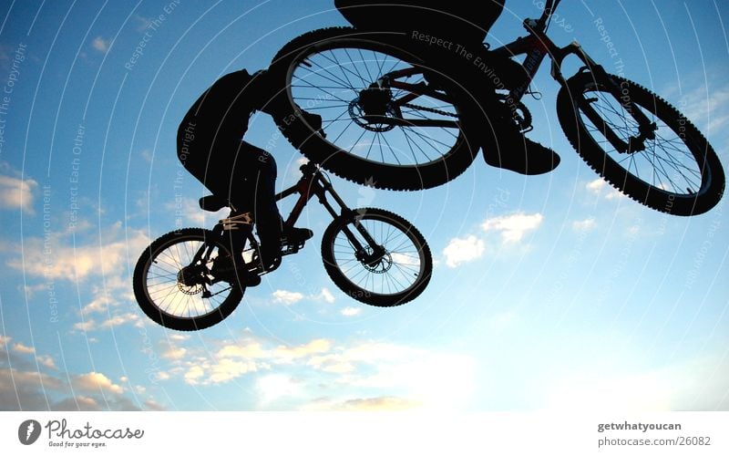 Wheel at the top Bicycle Jump Trick Stunt Ramp Air Back-light Clouds Black Extreme sports Brave Fear Flying street Feet Sky