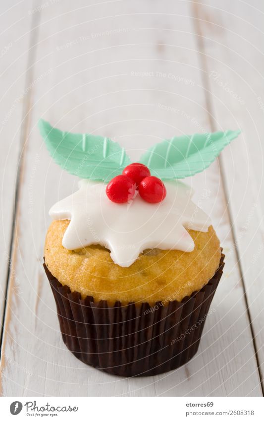 Christmas cupcake on white wood Food Healthy Eating Food photograph Baked goods Cake Dessert Candy Breakfast Christmas & Advent Good Sweet Red Cupcake Sugar
