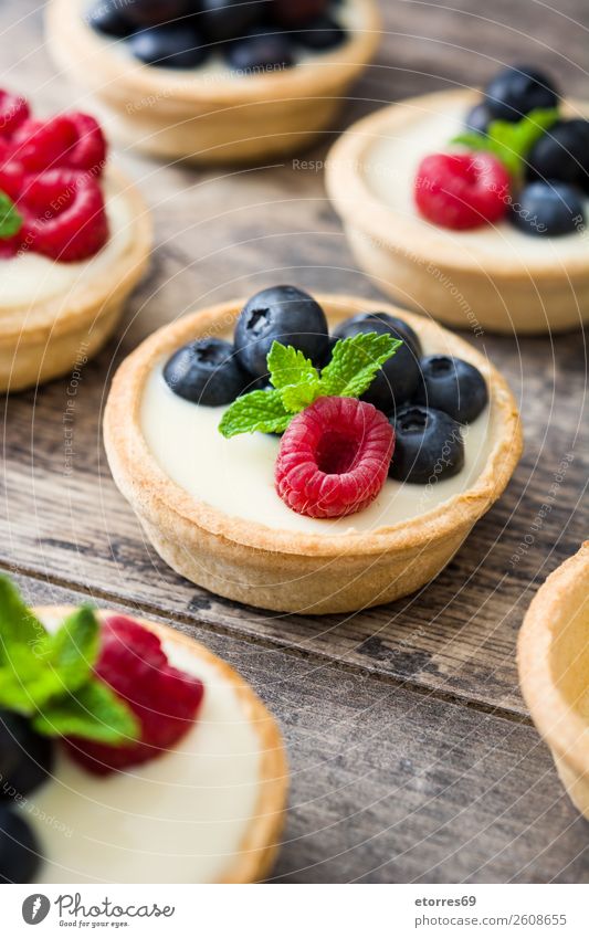 Delicious tartlets with raspberries and blueberries Tartlet Blueberry Raspberry Fruit Dessert Food Healthy Eating Food photograph Dish Cream custard Snack