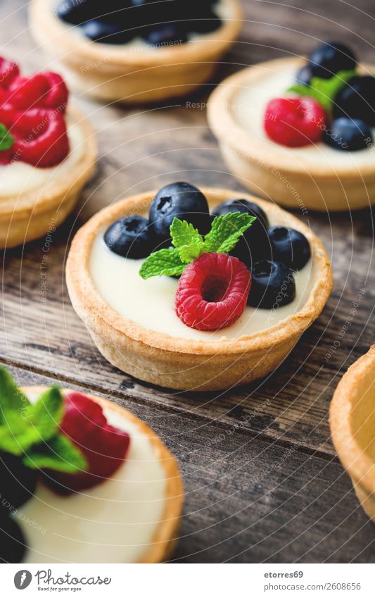 Delicious tartlets with raspberries and blueberries Tartlet Blueberry Raspberry Fruit Dessert Food Healthy Eating Food photograph Dish Cream custard Snack