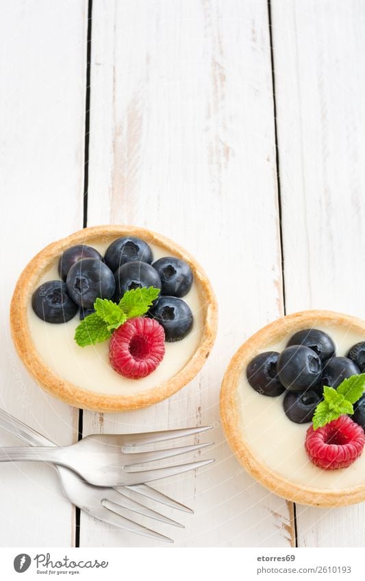 Delicious tartlets with raspberries and blueberries Tartlet Blueberry Raspberry Fruit Dessert Food Food photograph Healthy Eating Dish Cream custard Snack