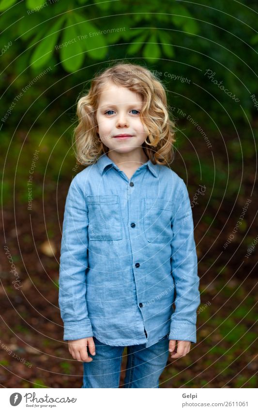 Happy small child with long blond hair Beautiful Face Summer Child Human being Baby Boy (child) Man Adults Infancy Environment Nature Plant Shirt Blonde Smiling