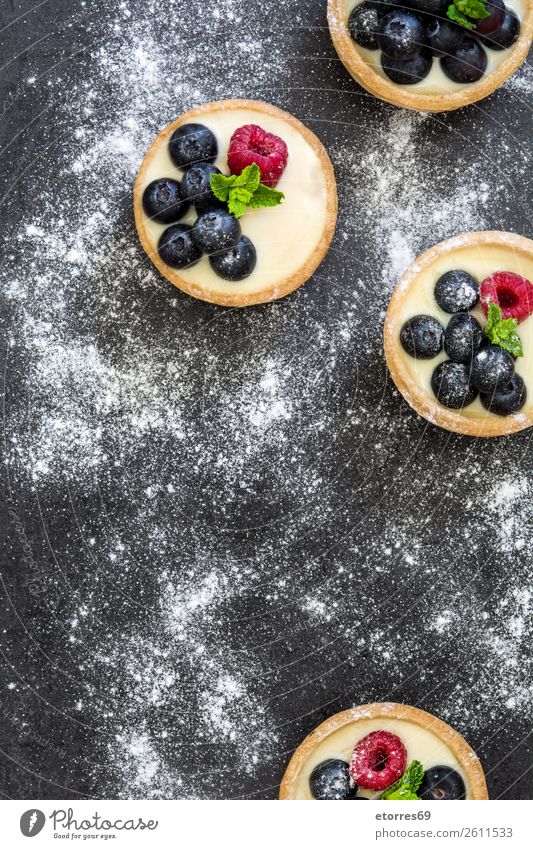 Delicious tartlets with raspberries and blueberries Tartlet Blueberry Raspberry Fruit Dessert Food Dish Food photograph Cream custard Snack glazed Baked goods