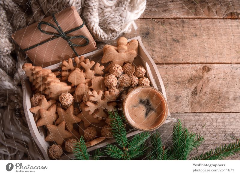 Cozy winter and Christmas lifestyle with fir branches, warm handmade socks  , ginger cat and envelope on white blanket, top view. Frame - a Royalty  Free Stock Photo from Photocase