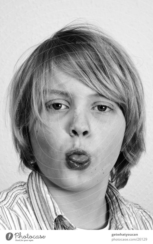 Lurch in the mouth Child Blonde Long Shirt Stupid Portrait photograph Boy (child) Mouth Tongue Hair and hairstyles Funny Eyes Nose Black & white photo Pelt