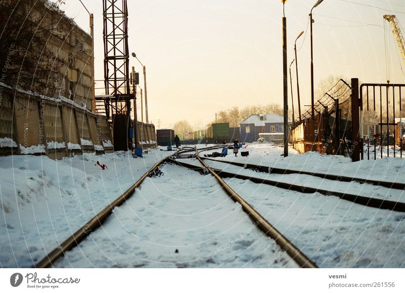 pathworthy Logistics Railroad Freight train Railroad tracks Cold Winter Industrial Industrial site Lantern Concrete wall Colour photo Exterior shot Deserted Day