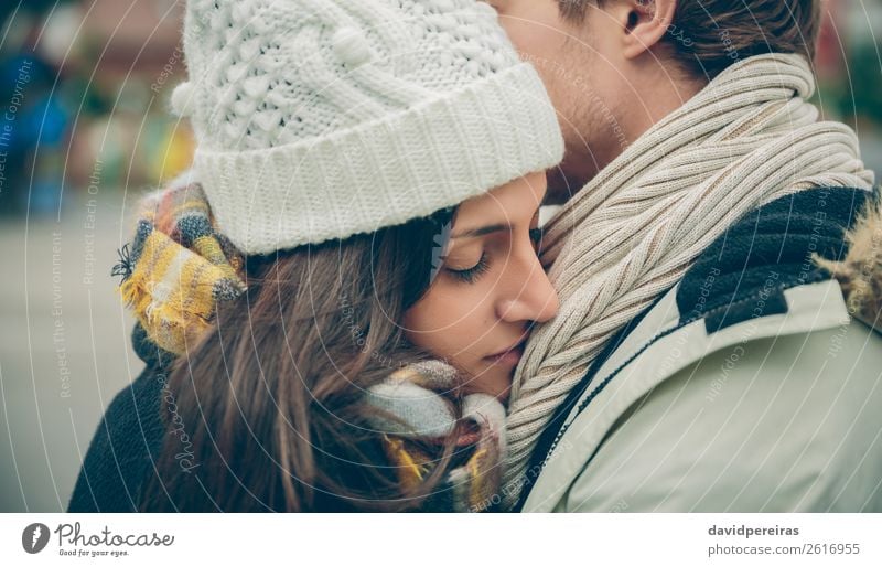 Young couple embracing outdoors in a cold autumn day Lifestyle Happy Beautiful Winter Human being Woman Adults Man Family & Relations Couple Autumn Rain Street