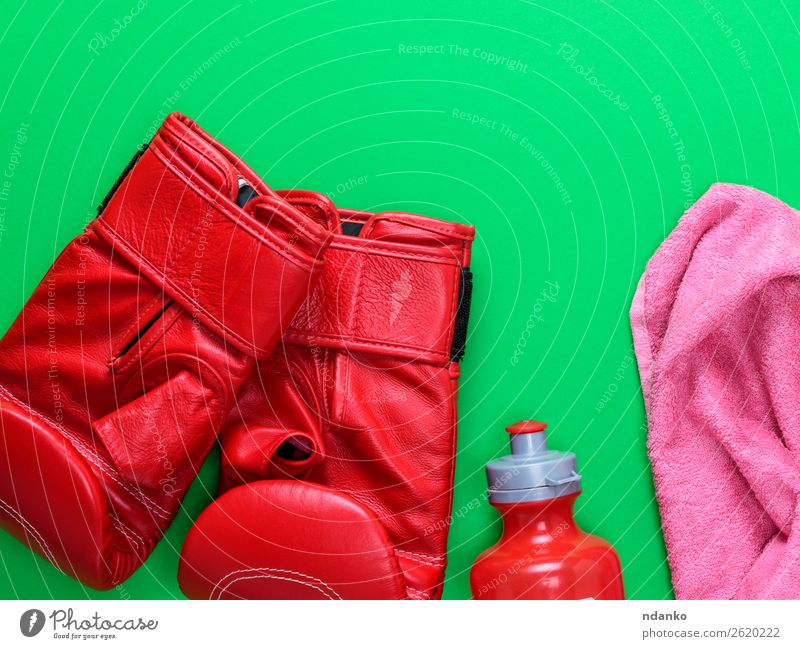 red leather boxing gloves, a plastic water bottle Bottle Sports Leather Gloves Fitness Above Green Pink Red Protection Competition Creativity Boxing pair