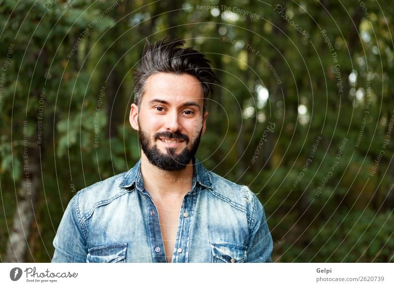 Free Photo  Handsome stylish bearded man walking in city street