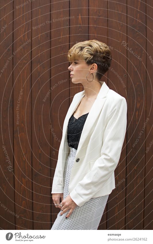young woman in suit Lifestyle Elegant Style Androgynous Young woman Youth (Young adults) Wall (barrier) Wall (building) Terrace Door Earring Short-haired