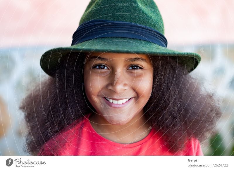 Pretty girl with long afro hair Elegant Happy Beautiful Face Winter Garden Child Human being Woman Adults Infancy Park Fashion Hat Brunette Afro Smiling