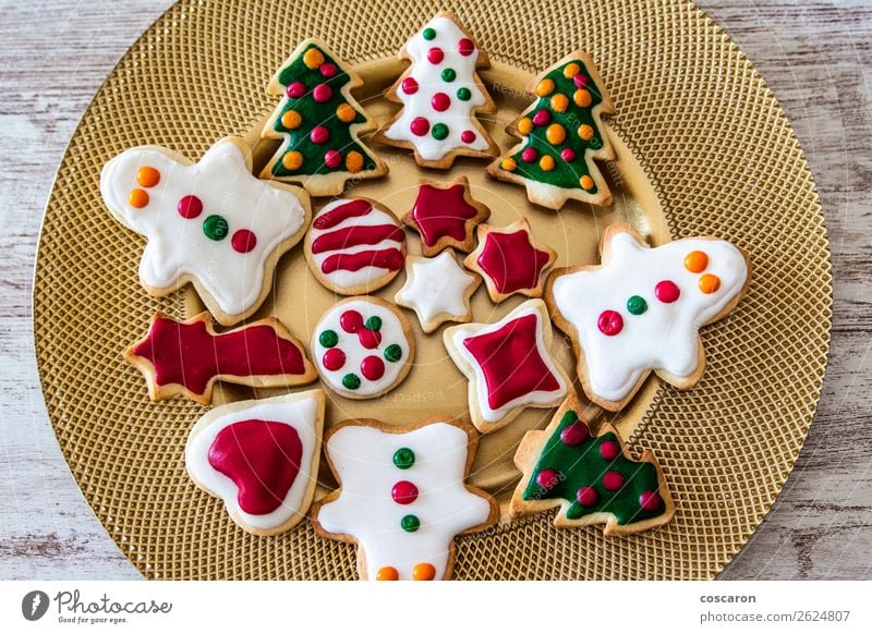 Christmas cookies on a dish with a wooden table background Food Cake Dessert Candy Plate Beautiful Leisure and hobbies Winter Snow Decoration Table