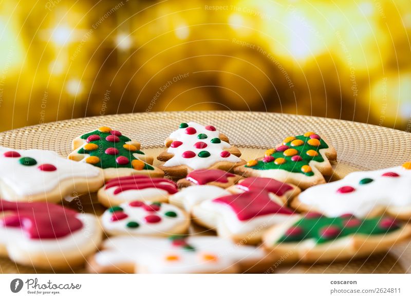 Christmas cookies on a dish with golden lights background Food Cake Dessert Candy Chocolate Plate Beautiful Winter Snow Decoration Table Feasts & Celebrations