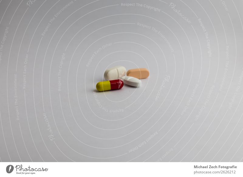 pills in different colors on white background Bowl Medical treatment Illness Medication Science & Research Wood Blue Yellow Pink Red White Colour Pill