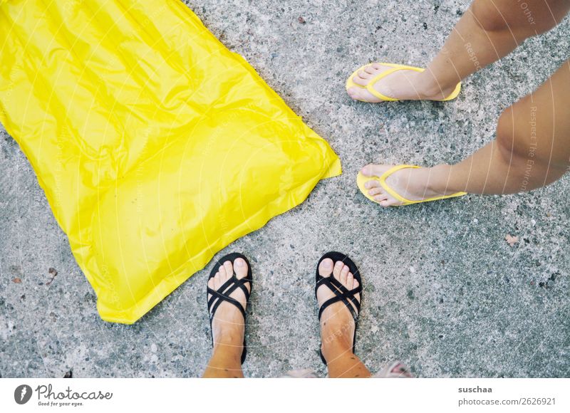 yellow air mattress Air mattress Inflated Summer Vacation & Travel Swimming & Bathing Beach be afloat Yellow Feet 2 people Legs Asphalt Flip-flops Warmth