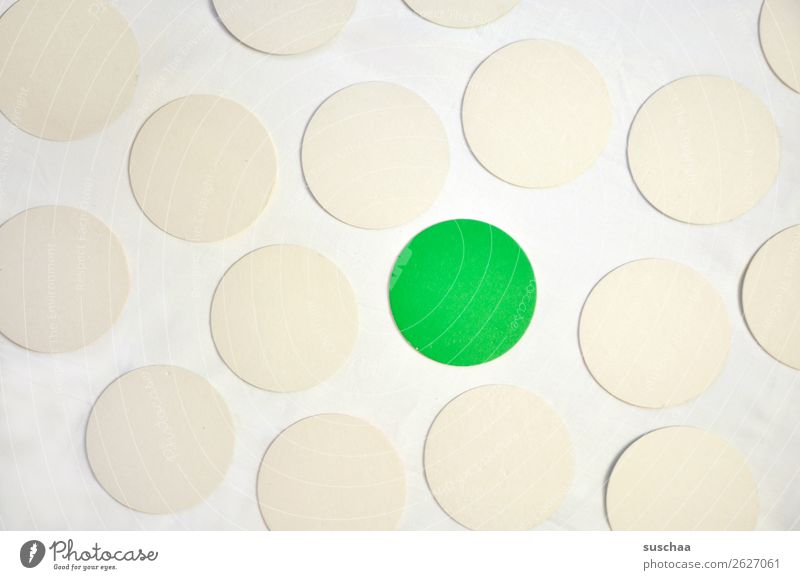 THE GREEN DOT Round Circle Point Colour White Green Symbols and metaphors Associative Center point exception Outsider Marginal group Stick out Protruding
