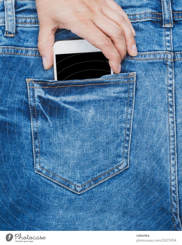 hand pulls out of the back pocket of a blue jeans smartphone Lifestyle Style Telephone PDA Screen Technology Hand Fashion Jeans To hold on Smart Blue Black