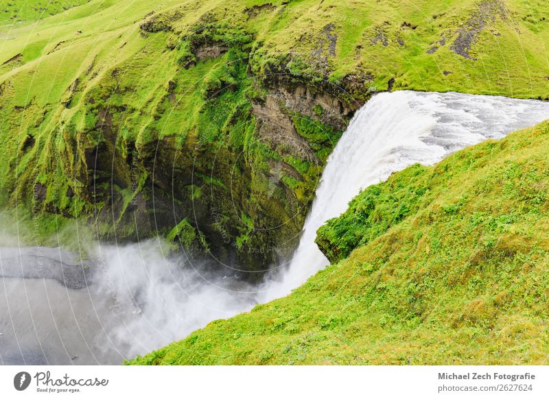 The famous skogafoss waterfall in southern iceland Lifestyle Vacation & Travel Tourism Summer Mountain Human being Man Adults Environment Nature Landscape Sky