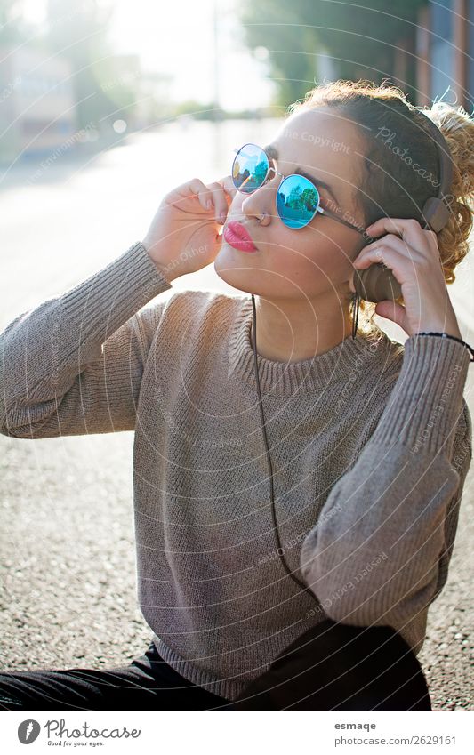Young woman listening to music in street Lifestyle Joy Wellness Youth (Young adults) Youth culture Music Listen to music Musician Fashion Accessory Sunglasses