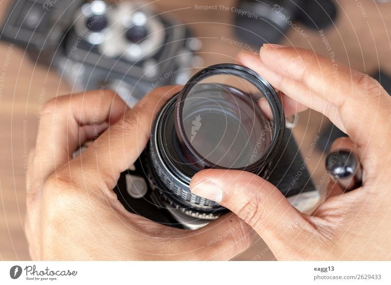 Placing a filter photographic camera film Lifestyle Style Camera Technology Eyes Places Old Modern Retro Black Creativity Flash Aperture background