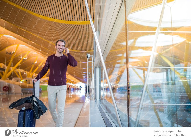 man front walking at the airport using mobile phone Airport Man Luggage Walking Vacation & Travel Bag Suitcase Business pulling Human being Cellphone traveler