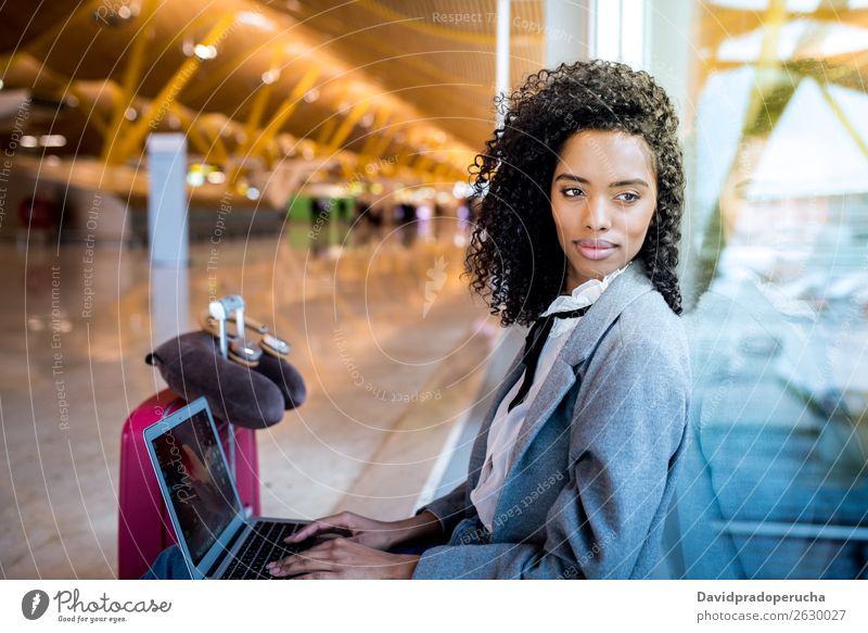 black woman working with laptop at the airport waiting at the window Airport Youth (Young adults) Smiling Wait Black Woman Story Sun Sunrise Window Sunlight