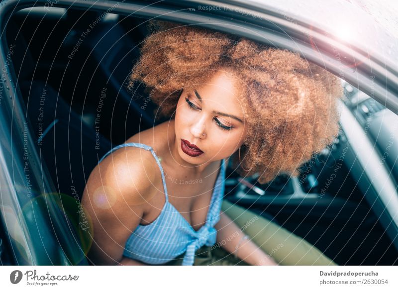 Mixed race woman sitting in a car Woman Smiling Portrait photograph Black Lifestyle multiethnic Transport Car Sit Vacation & Travel Driver Trip Drop Rain Wet