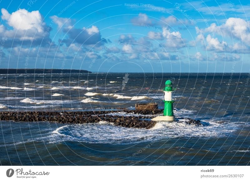 Mole at the Baltic Sea coast in Warnemünde Relaxation Vacation & Travel Tourism Ocean Waves Environment Water Clouds Climate Weather Gale Coast Lighthouse
