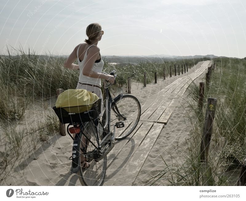 de duinen Vacation & Travel Tourism Trip Far-off places Cycling tour Summer Young woman Youth (Young adults) Woman Adults 1 Human being Coast North Sea Bicycle