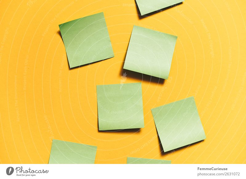 Notes on a neutral yellow background Stationery Paper Piece of paper Creativity Brainstorming Yellow Green Empty pasted self-adhesive Colour photo Studio shot
