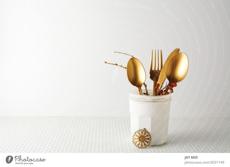 Festive golden cutlery knife and fork spoon in a white bottle Lunch Dinner Bottle Cutlery Fork Spoon Elegant Design Decoration Table Kitchen Restaurant
