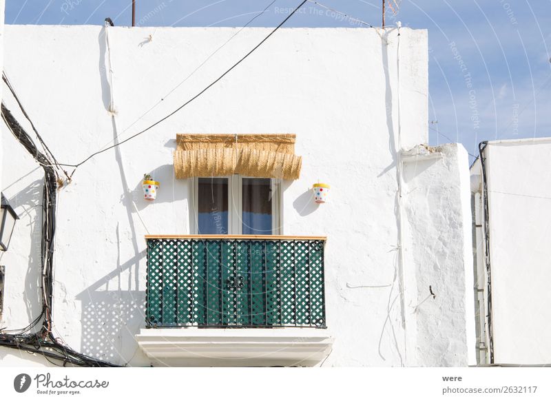 Facades of spanish houses Summer Flat (apartment) High-rise Old Uniqueness Andalusia balcony Green white striped spain blind Blue sky building copy space