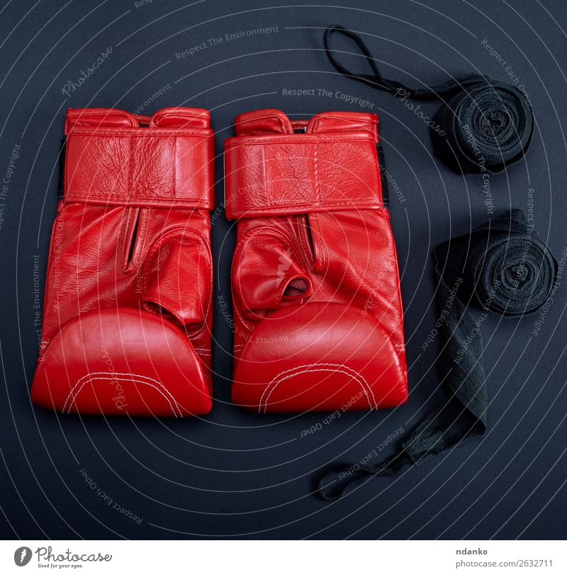 red leather boxing gloves and a black textile bandage Fitness Sports Leather Gloves Above Red Black Protection Colour Competition Creativity sporting background