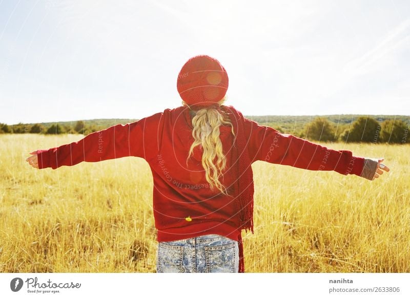 Back view of a young woman in nature in a sunny autumn day Lifestyle Beautiful Wellness Leisure and hobbies Adventure Freedom Sun Child Young woman
