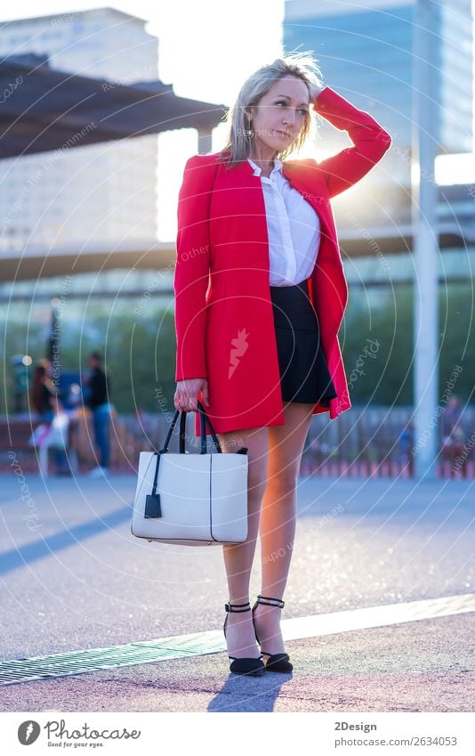 Elegant blonde woman standing in the street wearing red jacket Style Beautiful Human being Feminine Woman Adults Street Fashion Shirt Skirt Jacket Footwear