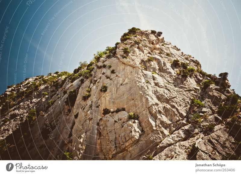 Tautavel V Environment Nature Landscape Cloudless sky Summer Rock Mountain Esthetic Sublime Upward Steep Cliff Southern France Overgrown Blue Brown Point