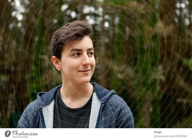 Attractive teenager guy in a park Lifestyle Style Happy Beautiful Hair and hairstyles Face Summer Human being Boy (child) Man Adults Youth (Young adults) Nature