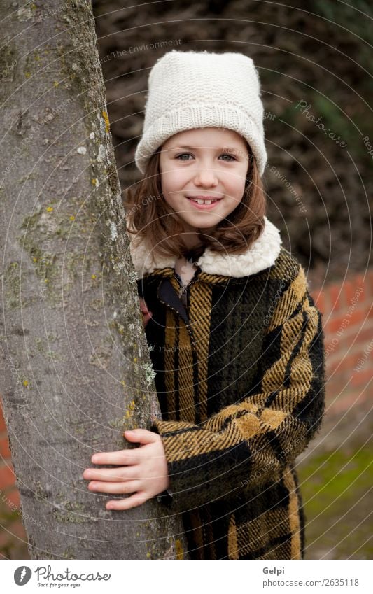 Pretty girl in a park at winter Joy Happy Beautiful Face Winter Garden Child Human being Toddler Woman Adults Family & Relations Infancy Nature Autumn Warmth