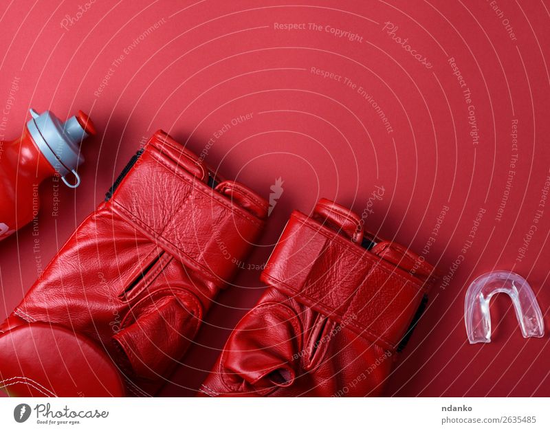 red leather boxing gloves Bottle Fitness Sports Leather Gloves Above Red Protection Colour Competition Creativity Action background boxer Boxing competitive