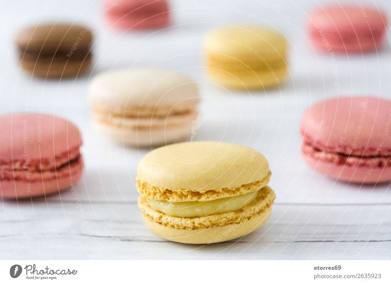 Colorful macarons on white wooden table Macaron Strawberry Lemon Dessert Coffee Yellow Chocolate Confectionary Raspberry Tradition Candy cut out cookies Tasty