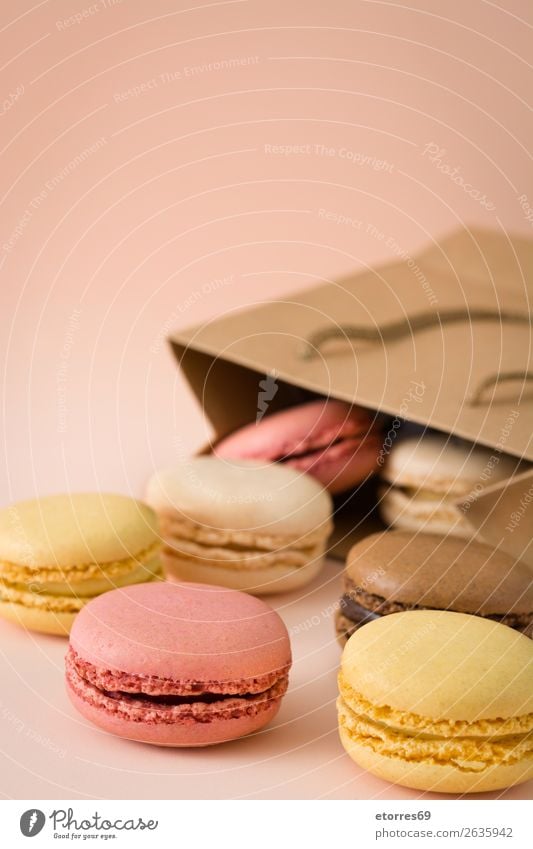 Colorful macaoundrons on brown background. Macaron Strawberry Lemon Dessert Coffee Yellow Chocolate Confectionary Raspberry Tradition Candy cut out cookies