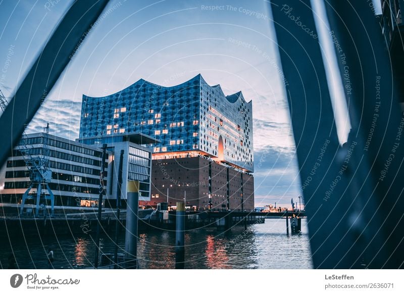 The glowing Elbphilharmonie Theatre Sky Clouds Sunrise Sunset Coast Hamburg Town Downtown House (Residential Structure) Dream house Bridge Architecture Facade