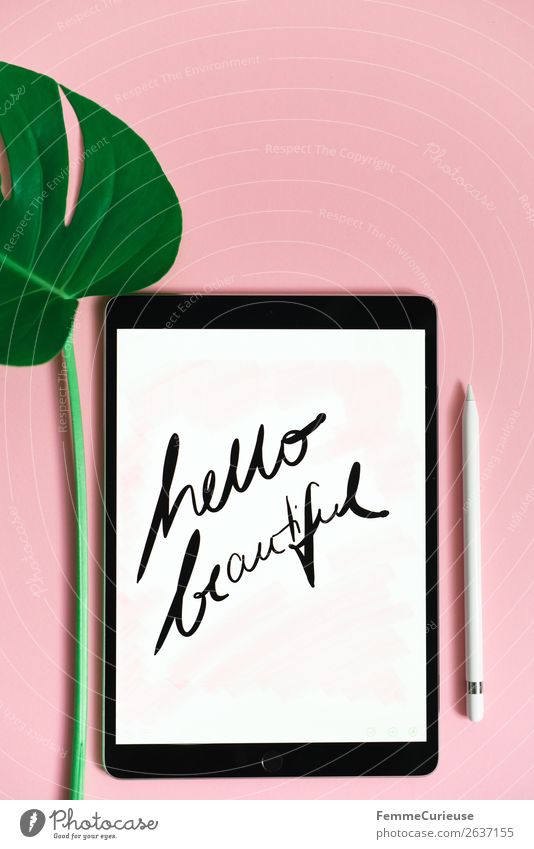 Tablet with a handwritten "hello beautiful" on pink background Technology Entertainment electronics Advancement Future Sign Characters Communicate Creativity