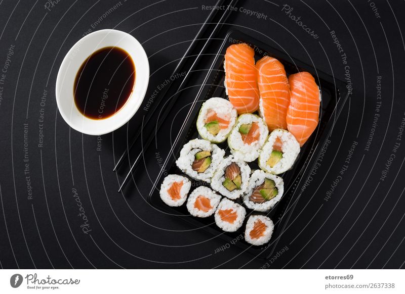 Japanese food: maki and nigiri sushi set on black background. Sushi Food Healthy Eating Food photograph Rice Fish Salmon Seafood Roll Meal Plate Gourmet Asia